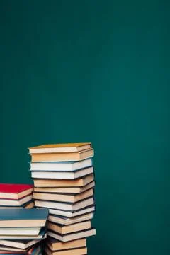 Many stacks of educational books for learning preparation for college exams on a Stock Photos