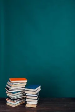 Many stacks of educational books for learning preparation for college exams on a 스톡 사진