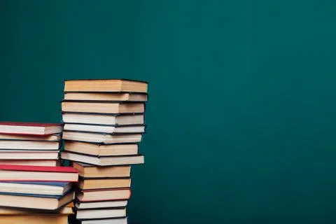 Many stacks of educational books for learning preparation for college exams on a Stock Photos