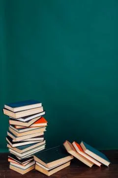 Many stacks of educational books for learning preparation for college exams on a Stock Photos