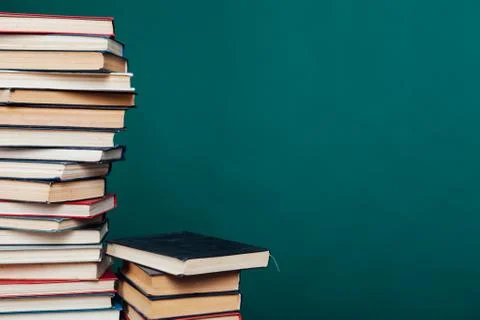 Many stacks of educational books for learning preparation for college exams on a 스톡 사진
