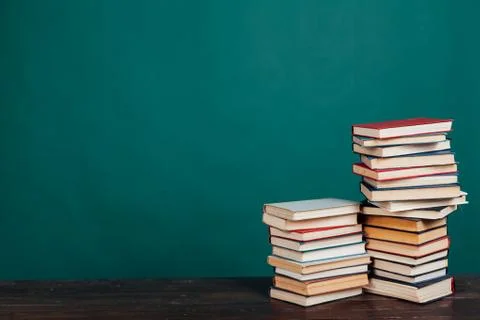 Many stacks of educational books for learning preparation for college exams on a 스톡 사진