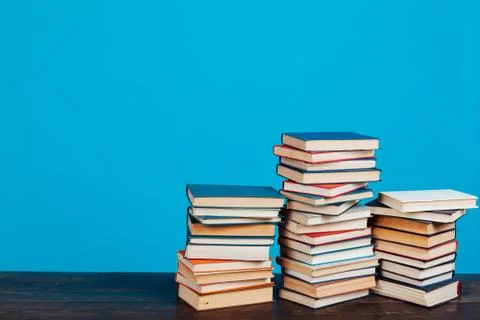 Many stacks of educational books for learning preparation for college exams on a Stock Photos