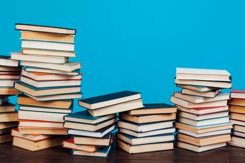 Many stacks of educational books for learning preparation for college exams on a Stock Photos