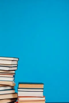 Many stacks of educational books for learning preparation for college exams on a 스톡 사진
