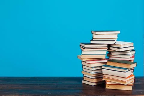 Many stacks of educational books for learning preparation for college exams on a 写真素材