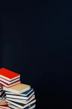 Many stacks of educational books for learning preparation for college exams on a Stock Photos