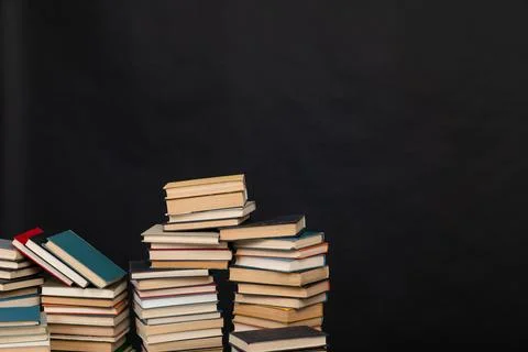 Many stacks of educational books to study in the university library on a Stock Photos