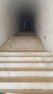Many steps in the tunnel of the old crypt, climbing up Fotos de archivo
