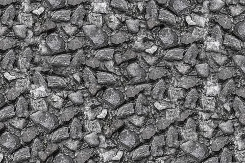 Many stones gray sharp rough uneven steel tone monochrome canvas small cobble Stock Photos