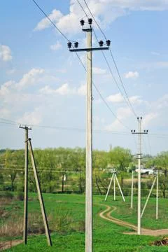 Many straight electrical pole with wire. rural view Stock Photos