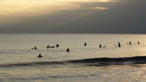 Many sufers in the Evening Stock Footage 138691473