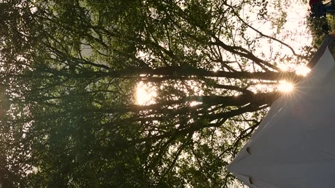 Many suns bounce off the surface of the water. Camping and Summer Vacation Stock Footage 247965029