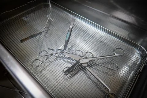Many surgical instruments are cleaned in an ultrasonic bath Stock Photos