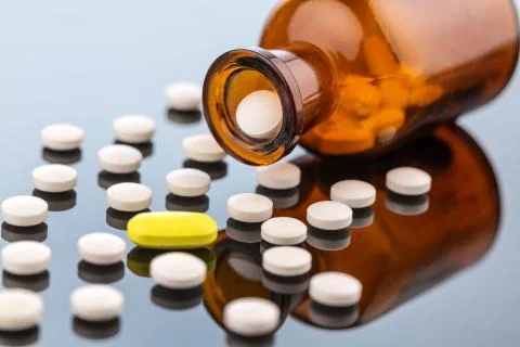 Many tablets with container 스톡 사진