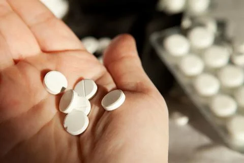 Many tablets in hand Stock Photos