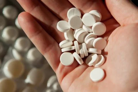 Many tablets in hand Stock Photos