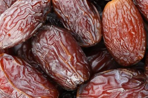 Many tasty dried dates as background, closeup Foto stock