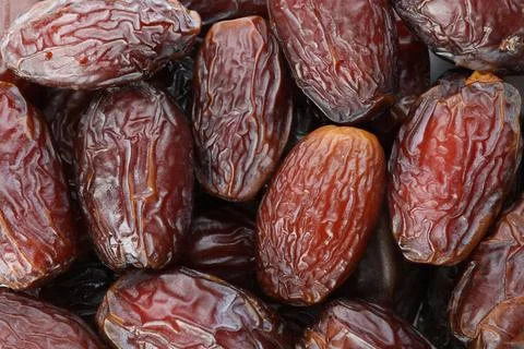 Many tasty dried dates as background, closeup Foto stock