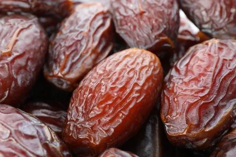 Many tasty dried dates as background, closeup Foto stock