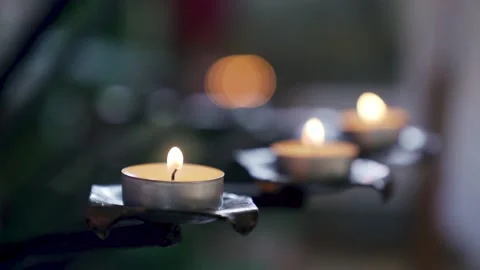 Many tea lights candles burning in a Christian church chapel. Close up shot Stock Footage 232936218