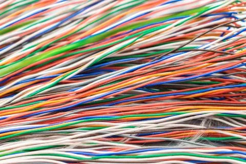 Many thin electrical wires of different colors. Cables for telephone and inte 库存照片