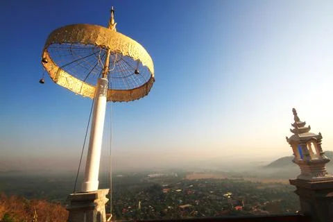 A many-tiered state umbrella in the temple on the mountain of Thailand Stock Photos