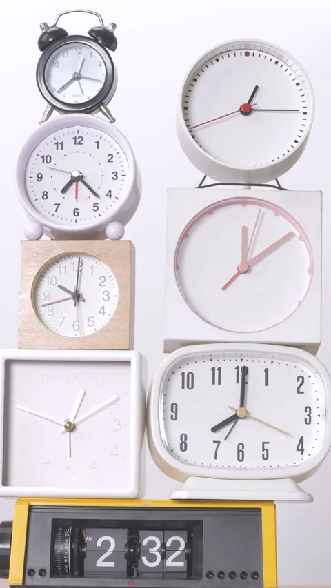 Many time clocks on a white background Tell the time at speed. Stock Footage 257644610