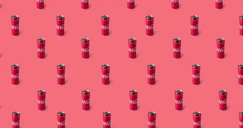 Many tin coca cola cans on a red background. animated pattern Stock Footage 132567977