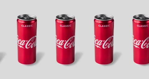 Many tin coca cola cans on a gray background close-up. animated pattern Stock Footage 132568622