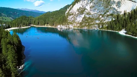 Many tiny beautiful boats floating on the lake in Italy, Tirol. Boats floating Stock Footage 118976683