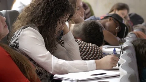 Many tired students sleeping in the lecture hall during a boring presentation Stock Footage 69927708