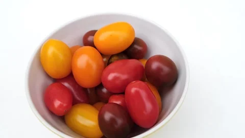 Many tomatoes in a yellow cup Stock Footage 255313529