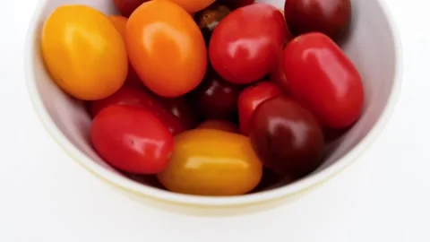 Many tomatoes in a yellow cup. Stock Footage 255313533