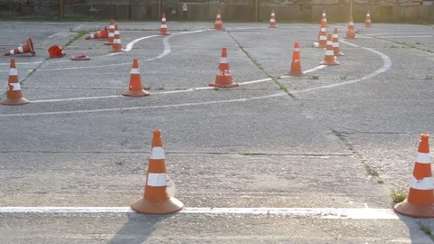 Many traffic cones stand or lie on the road Stock Footage 107911328