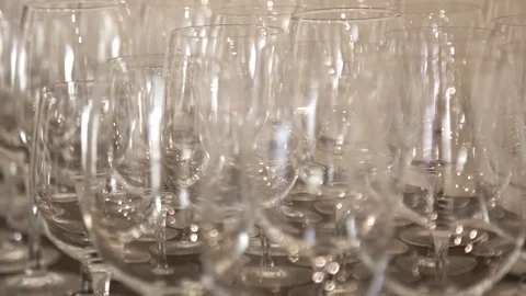 Many Transparent Empty Wine Glasses Close-up. Abstract blurred background. Stock Footage 109420375