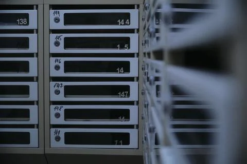 Many transparent mailboxes with numbers Stock Photos