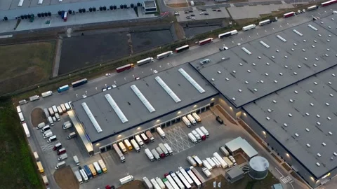 Many trucks are parked in the parking lot of the logistics center Stock Footage 225664249