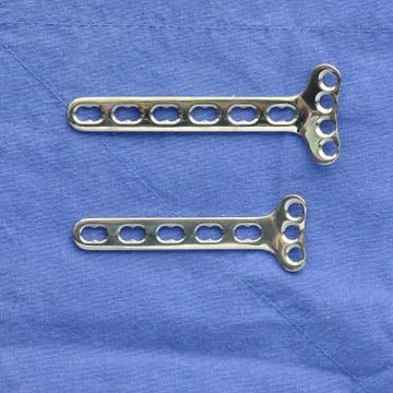 Many type of  surgery-plates straight and narrow on blue cloth Stock Photos