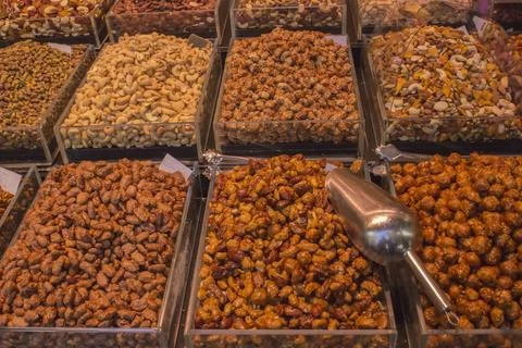 Many types of different nuts in boxes on the shelves 写真素材