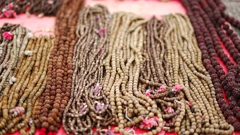 Many types of PRAYER BEADS in line. GARLAND for sale in indian street market. Stock Footage 159130201