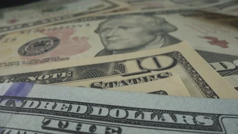 Many USA dollars bills on the table. Macro shot with watermarks, inscription Stock Footage 141177888