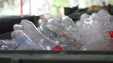 Many used plastic bottles in a trash can. sorted trash. ecological catastrophy  Stock Footage 127368689