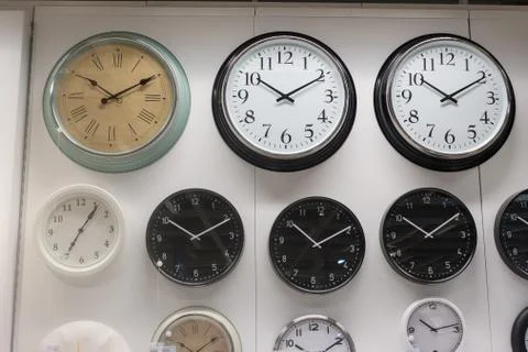 Many wall clock on the wall Stock Photos