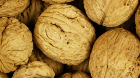 Many walnuts completely fill the frame. Close up view Stock Footage 181598017