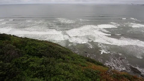 Many waves on the rocky beach Stock Footage 78521978