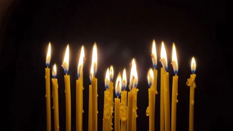 Many wax thin candles burn brightly. Religion concept. Stock-Footage 172537828