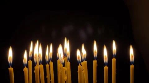 Many wax thin candles burn brightly. Religion concept. Stock-Footage 181574986