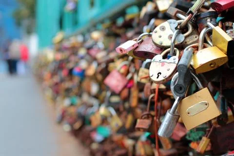 Many wedding locks on the bridge in Prague. Beautiful wedding background. Bac Stock Photos
