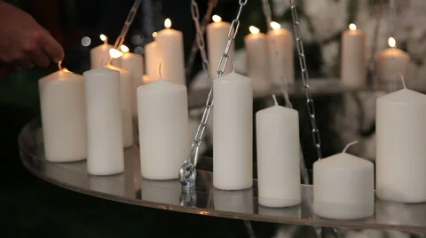 Many white candles  on the table Stock Footage 64008497